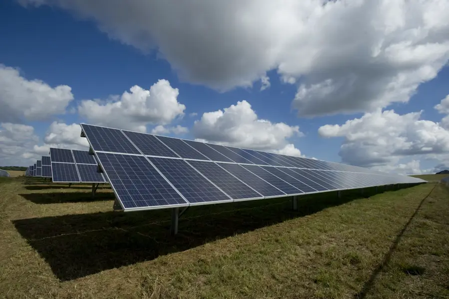 Rooftop solar panel installation under clear sky